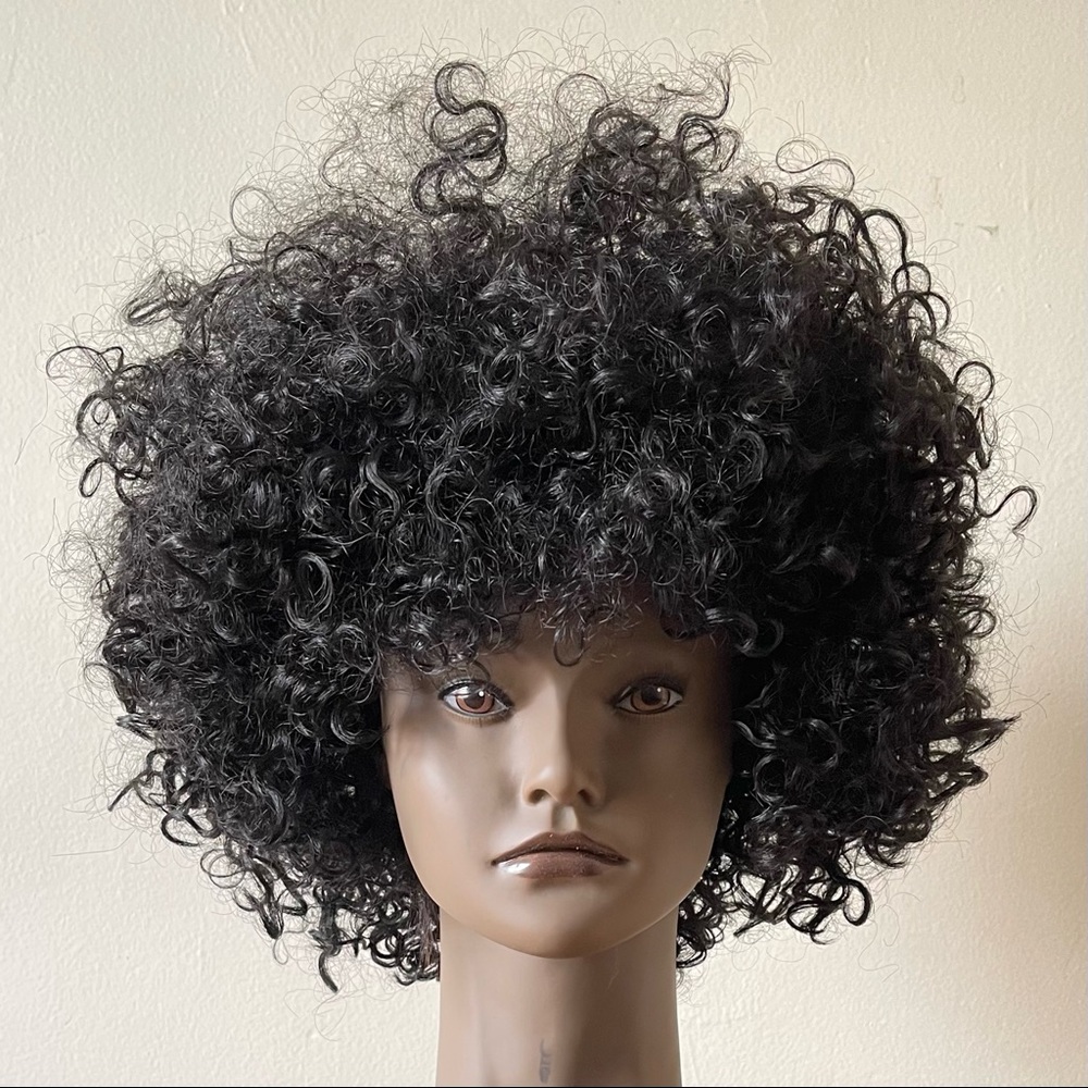 This is a beautiful black curly wig. Only worn once and in great shape.